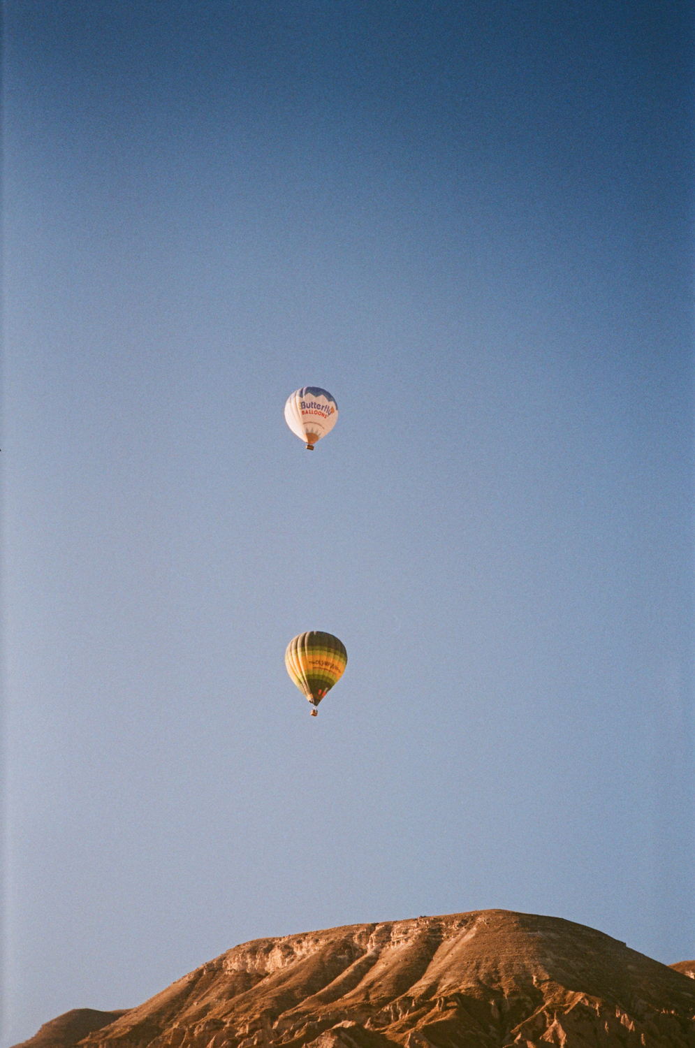 Photo: Two balloons flying over Cappadocia